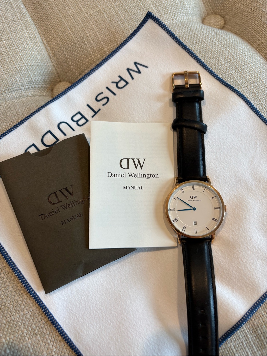 Daniel Wellington Black Leather Watch With Gold Case, White Dial, Blue Hands